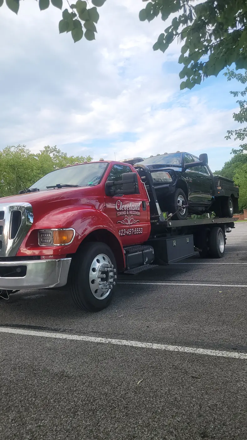A pickup winched up and strapped down on the deck
